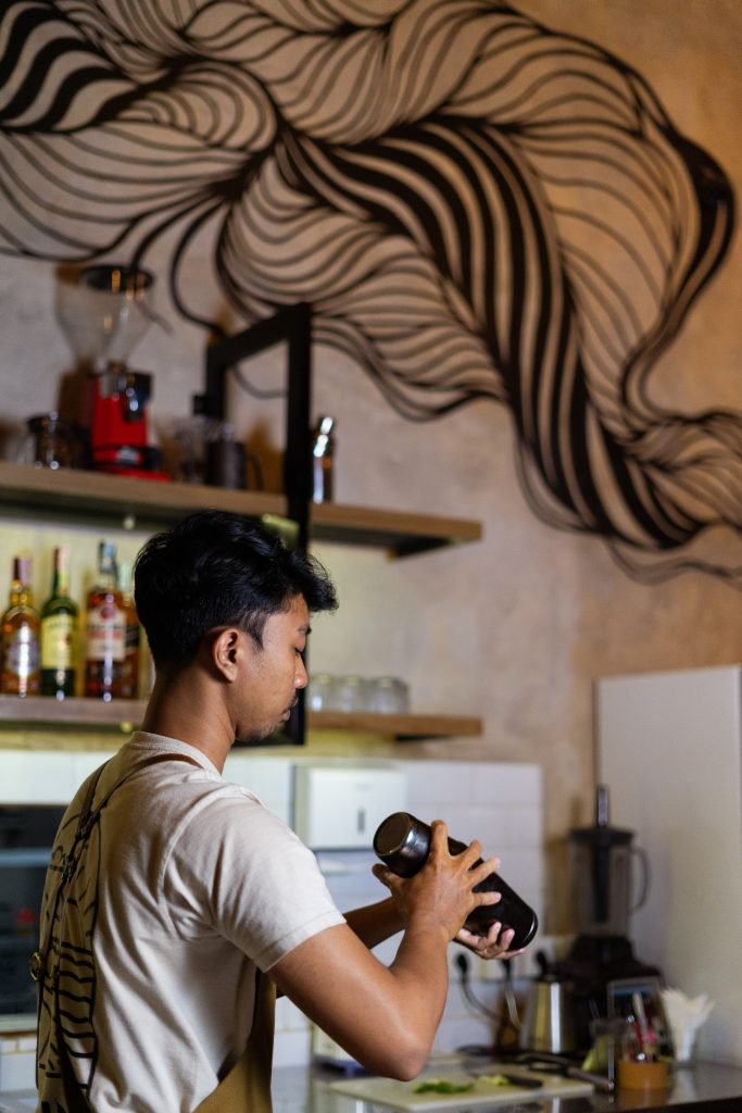 Barista mixing drinks at the Camino bar in Jimbaran