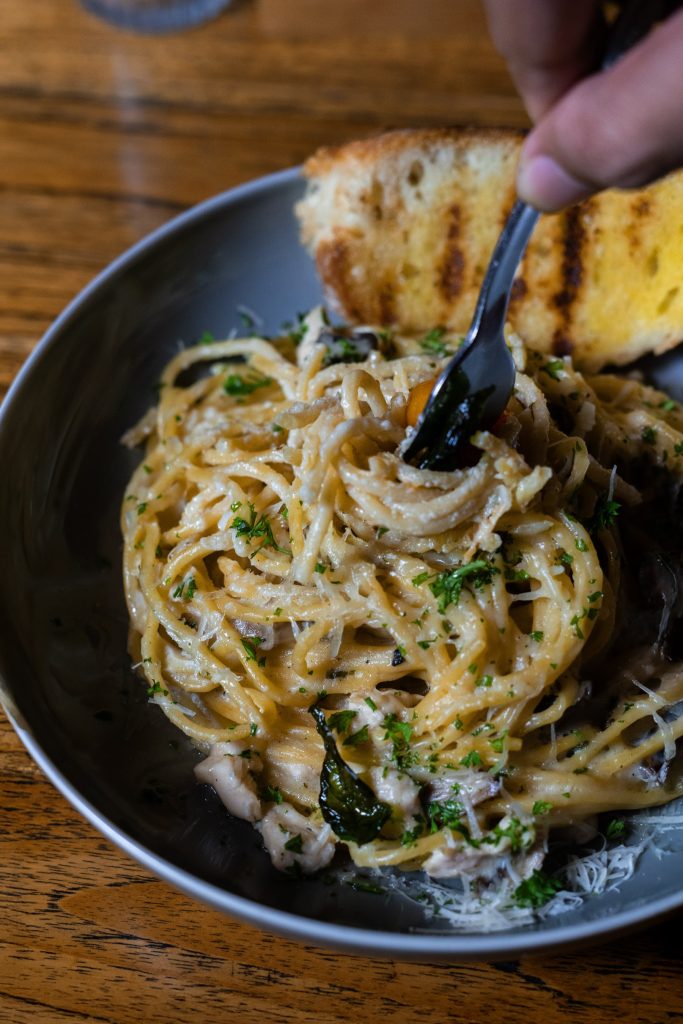 Pasta with garlic bread at Camino Resto & Bar